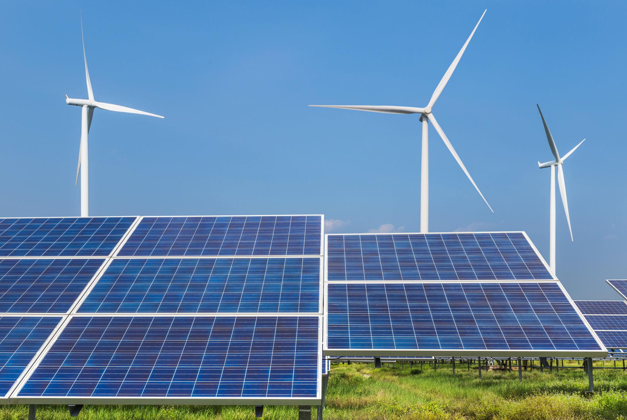 Wind turbines and solar panels, now the cheapest power we have ever built.
